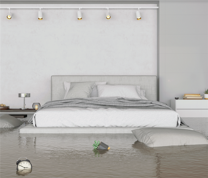 a flooded bedroom with furniture floating everywhere